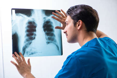 Young handsome doctor radiologyst working in hospital