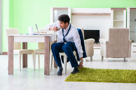 Man dressing up and late for workの写真素材