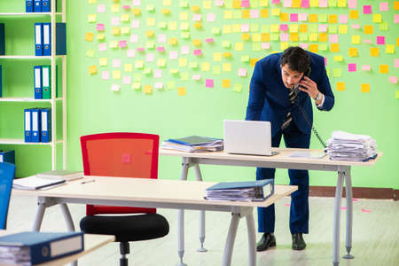 Businessman with many conflicting prioritiesの写真素材