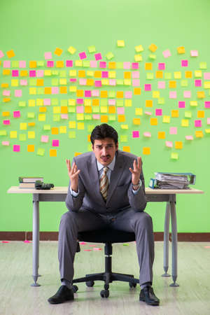 Businessman with many conflicting prioritiesの写真素材