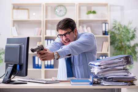 Stressful businessman working in the officeの写真素材