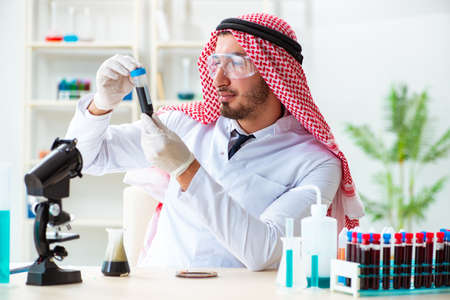 Arab chemist working in the lab officeの写真素材
