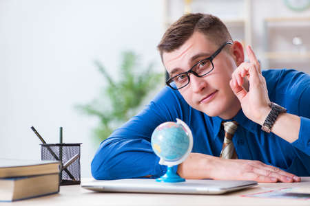 Young employee preparing for vacation tripの写真素材