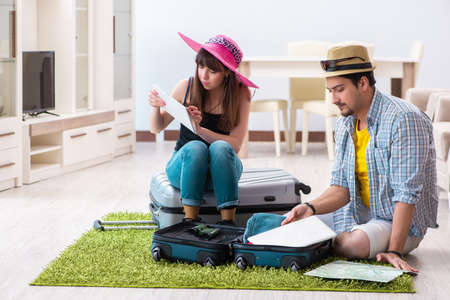 Young family packing for vacation travelの写真素材