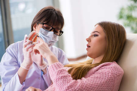 Woman patient visiting dentist for regular check-upの写真素材