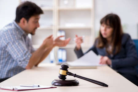 Female lawyer meeting with his male client in the officeの写真素材