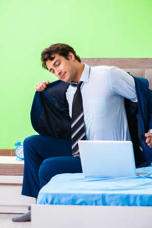 Businessman working in the hotel roomの写真素材