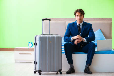 Businessman working in the hotel roomの写真素材