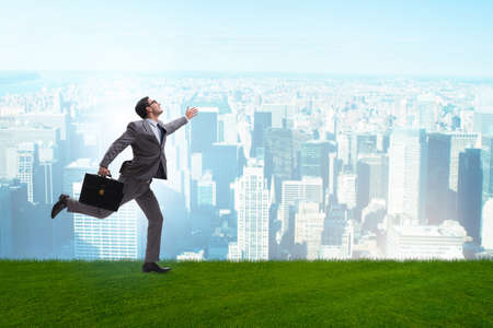 Happy businessman running towards his goalの写真素材