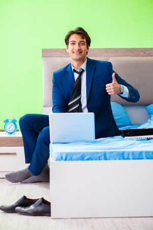 Businessman working in the hotel roomの写真素材