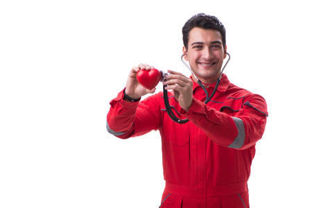 Young handsome man with stethoscope and heart  in red uniform is