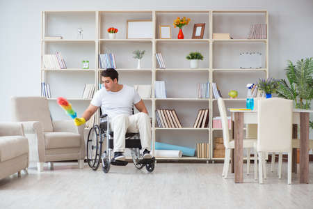 Disabled cleaner doing chores at homeの写真素材