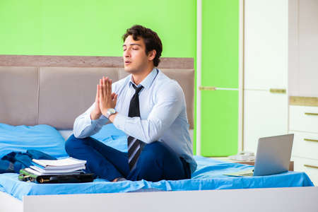 Businessman working in the hotel roomの写真素材