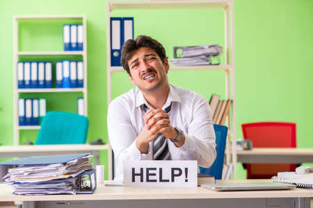 Sick and unhappy businessman sitting in the office