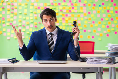Businessman with many conflicting prioritiesの写真素材