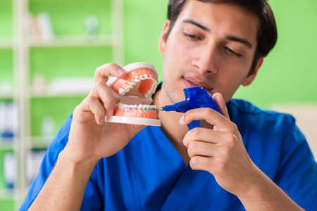 Dentist doctor working on new tooth implant