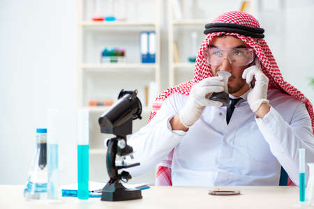 Arab chemist scientist testing quality of oil petrolの写真素材