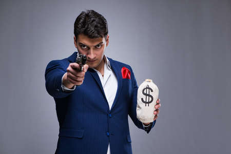 Handsome man against gray backgroundの写真素材