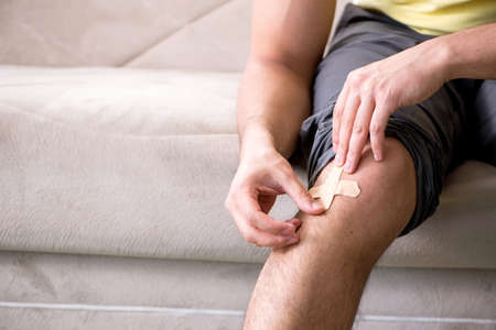 Young man at home after injury