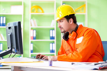 Construction supervisor planning new project in officeの写真素材