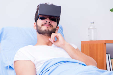 Patient in the hospital with VR glasses headset