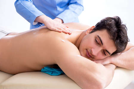 Man in spa enjoying his timeの写真素材