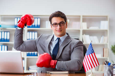 Businessman with American flag in officeの写真素材