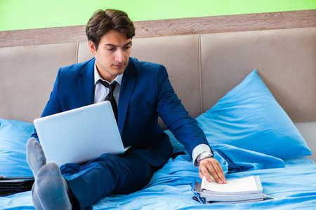 Businessman working in the hotel room