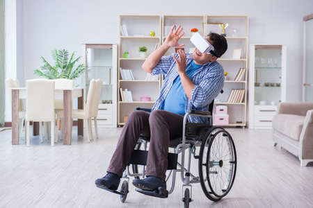 Disabled man studying with virtual reality glasses