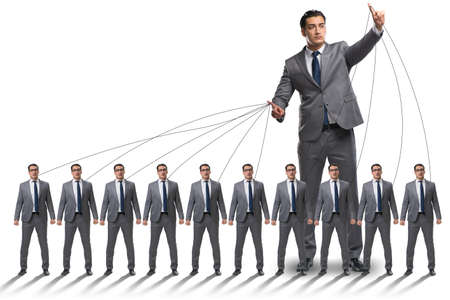 Boss employee manipulating his staff in business conceptの写真素材