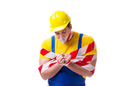 Funny worker wearing coveralls with tape