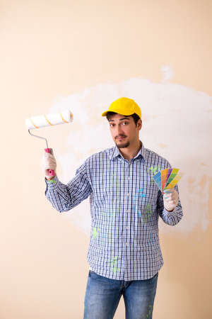 Painter man painting the wall at homeの写真素材