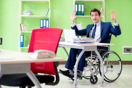Disabled businessman working in the officeの写真素材