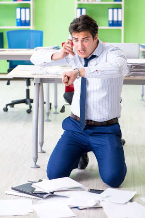 Frustrated businessman stressed from excessive workの写真素材