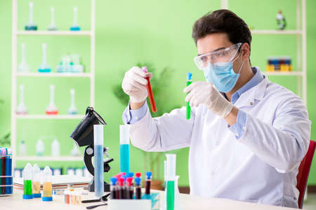 Man chemist working in the lab