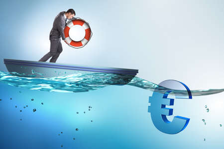 Businessman saving euro currency from inflationの写真素材