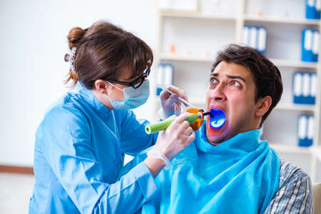 Patient afraid of dentist during doctor visitの写真素材