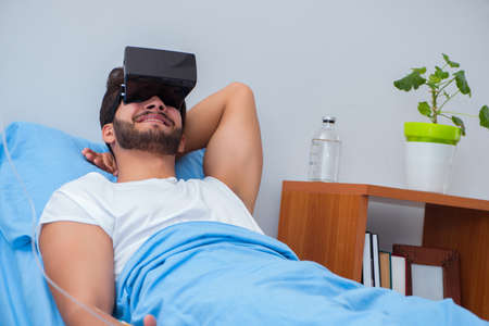 Patient in the hospital with VR glasses headset