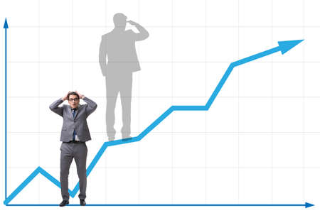 Businessman and his shadow in business concept
