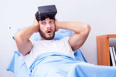 Patient in the hospital with VR glasses headset