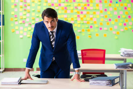 Businessman with many conflicting prioritiesの写真素材