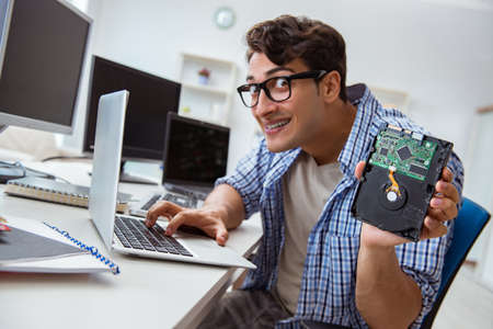 Technician with broken hard drive