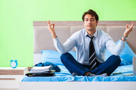 Businessman working in the hotel roomの写真素材