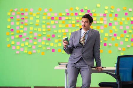 Businessman with many conflicting prioritiesの写真素材