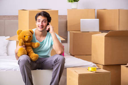 Young man moving to new apartment