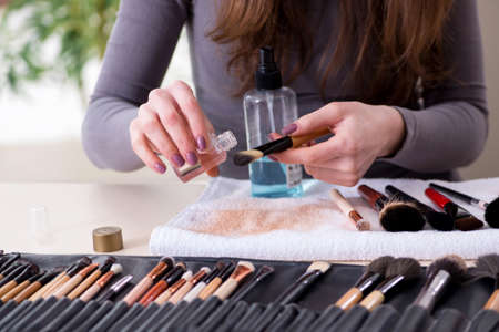 Make-up artist preparing brushes for work