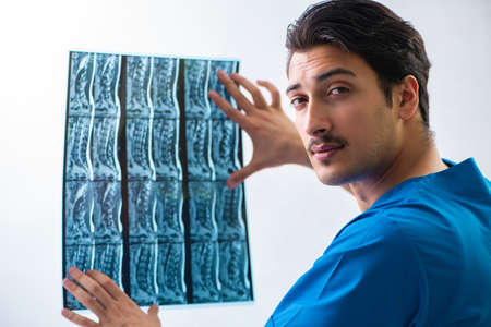 Young handsome doctor radiologyst working in hospital