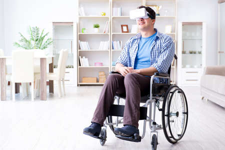Disabled man studying with virtual reality glassesの写真素材