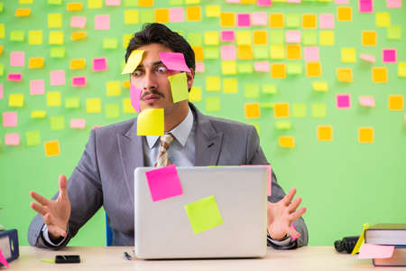 Businessman with many conflicting prioritiesの写真素材