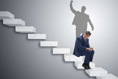 Businessman and his shadow in business conceptの写真素材